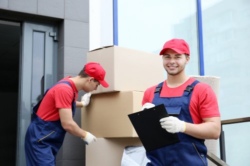 Professional movers preparing a piano removal in Norwood