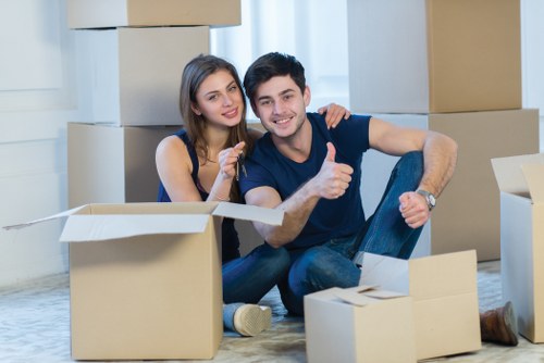 Removals staff following safe working methods during a move