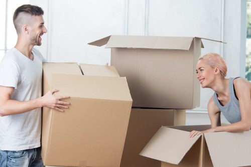 Professional movers loading furniture into a van in Norwood
