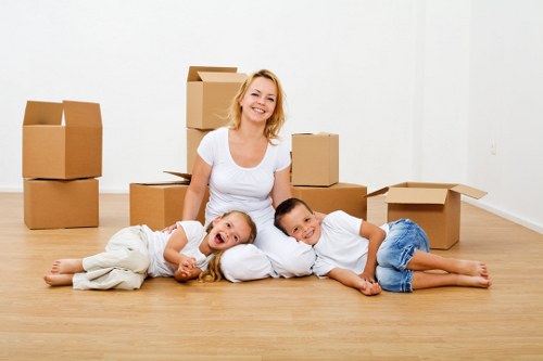Removal team beginning a scheduled move with packed boxes