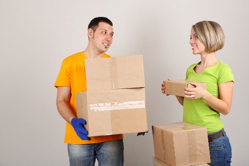 Professional movers organizing furniture and fragile items
