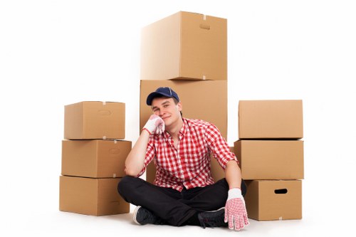 Furniture moving team packing and protecting items for transit